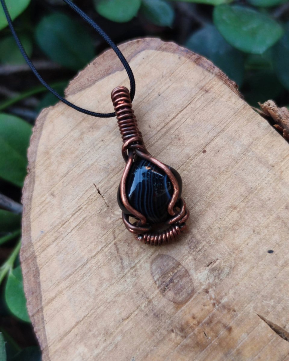 Invest in our Whispering Shadow Black Agate Necklace from our Crystal Wrapped in Copper Jewelry in Lebanon at Sacred!