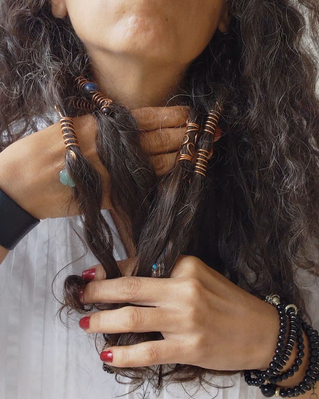 Adorn your Crown with Magic. Handmade copper loc coils with natural crystals, crafted in Lebanon. Find your unique hair jewelry at Sacred.