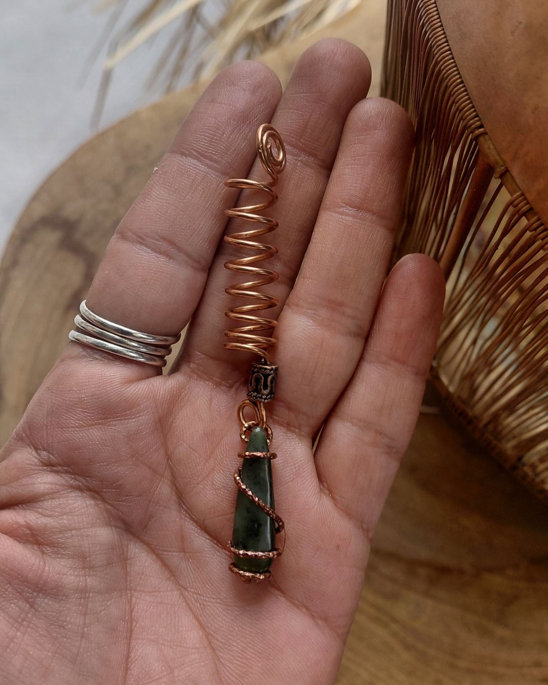 Adorn your Crown with Magic. Handmade copper loc coils with natural crystals, crafted in Lebanon. Find your unique hair jewelry at Sacred.