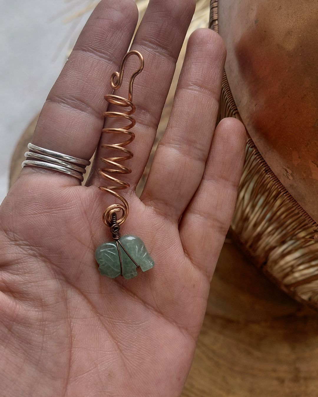 Adorn your Crown with Magic. Handmade copper loc coils with natural crystals, crafted in Lebanon. Find your unique hair jewelry at Sacred.