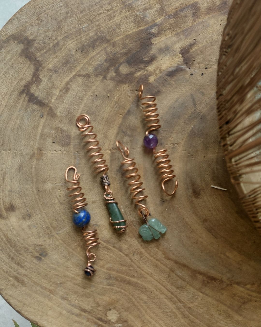 Adorn your Crown with Magic. Handmade copper loc coils with natural crystals, crafted in Lebanon. Find your unique hair jewelry at Sacred.