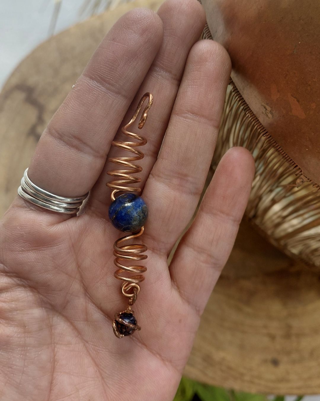Adorn your Crown with Magic. Handmade copper loc coils with natural crystals, crafted in Lebanon. Find your unique hair jewelry at Sacred.