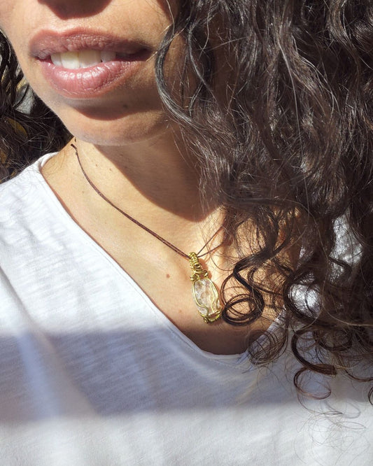 Connect to Higher Consciousness with Divine in Brass Invest in our Clear Quartz Pendant at Sacred in Lebanon.