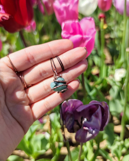 Invite Wealth with Nature's Heart. Invest in our Tumbled Emerald Pendant from our Handcrafted & Energy Cleansing Jewelry Collection at Sacred in Lebanon.