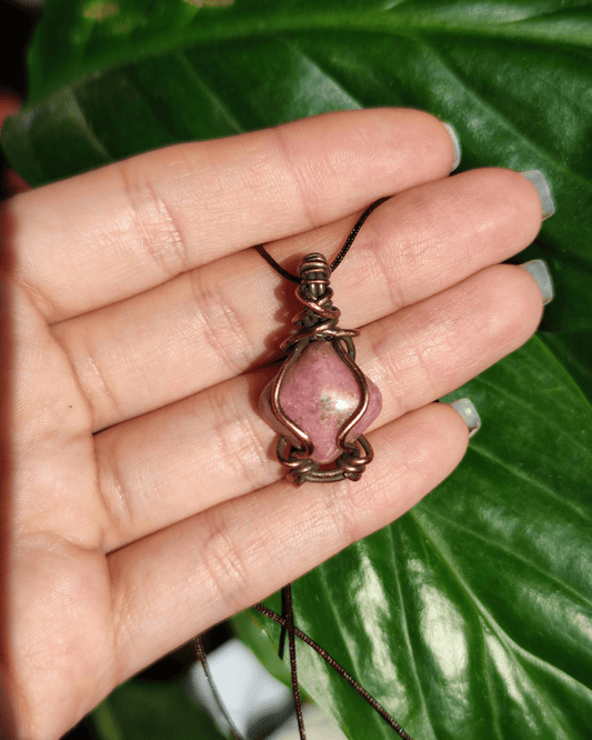 Reclaim your Sovereignty with Pink Highness. Invest in our natural Rhodonite Pendant from our Handcrafted Crystal Jewelry Collection in Lebanon at Sacred.