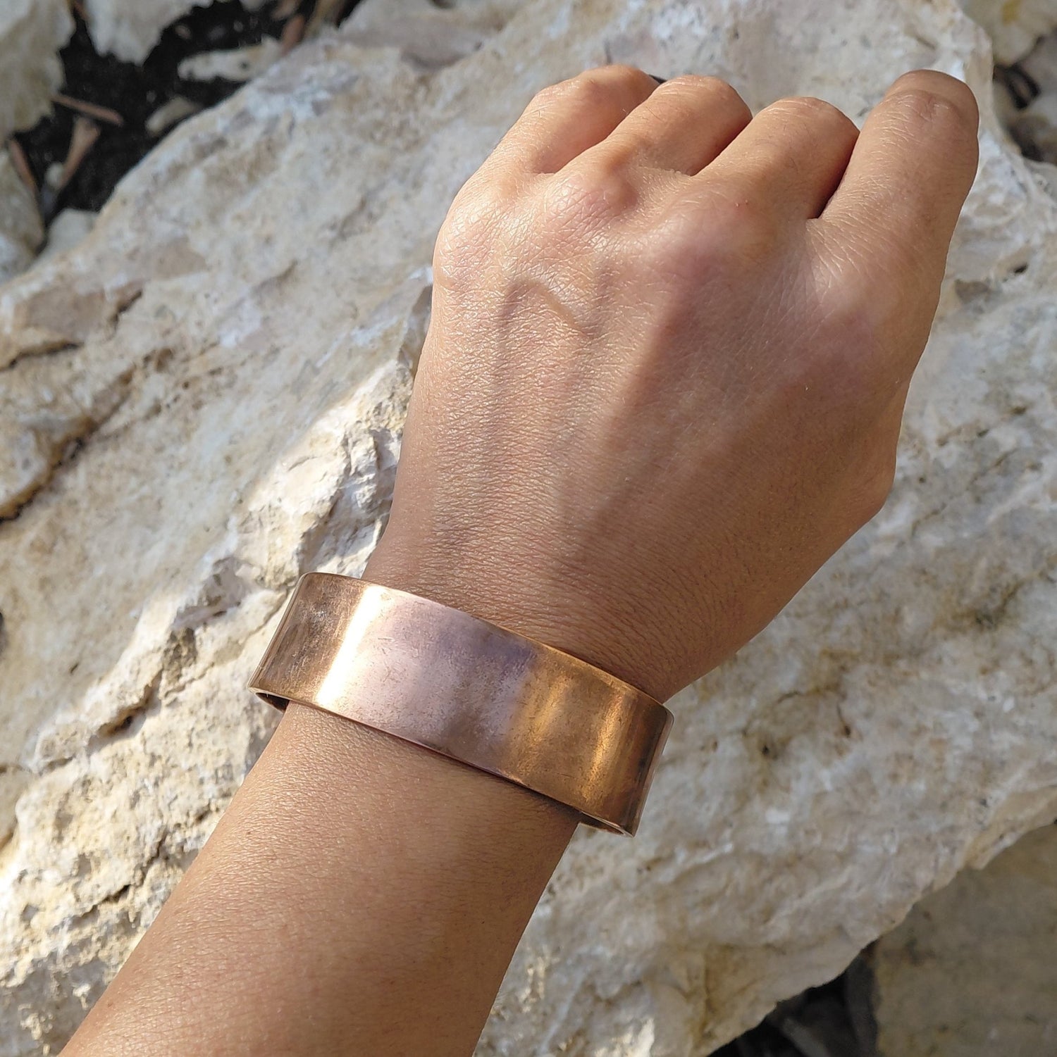 Close-up profile of the Wide Flat Band Red Copper bracelet from the Red Copper Bracelets collection in Lebanon at Sacred