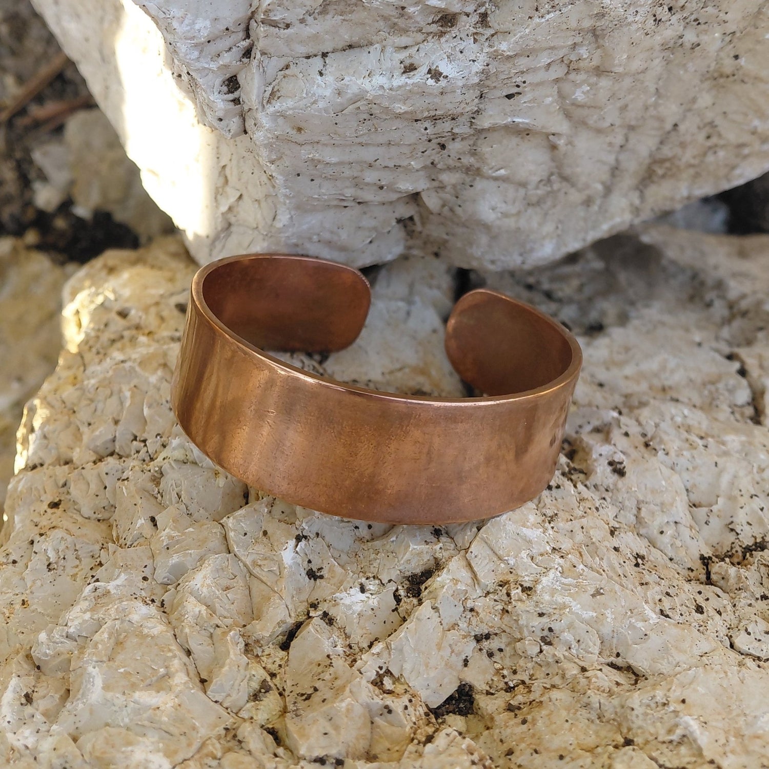 Close-up profile of the Wide Flat Band  Red Copper bracelet from the Red Copper Bracelets collection in Lebanon at Sacred