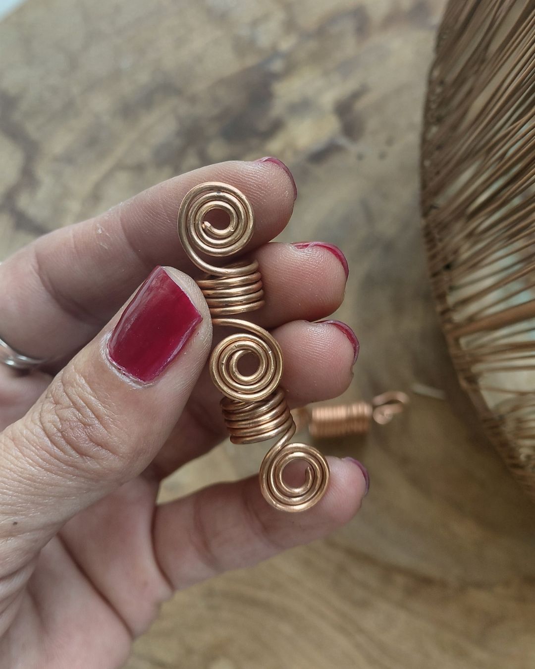Extend your self-expression. Sleek, minimalist copper loc coils designed to embrace natural texture. Earthy hair jewelry, handmade in Lebanon at Sacred.