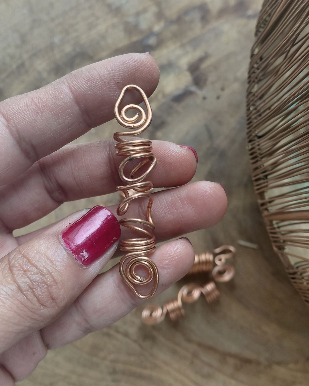 Extend your self-expression. Sleek, minimalist copper loc coils designed to embrace natural texture. Earthy hair jewelry, handmade in Lebanon at Sacred.