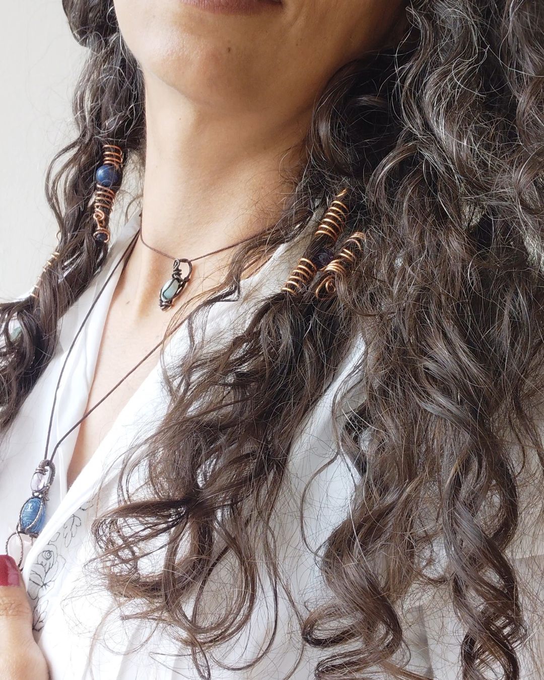 Extend your self-expression. Sleek, minimalist copper loc coils designed to embrace natural texture. Earthy hair jewelry, handmade in Lebanon at Sacred.