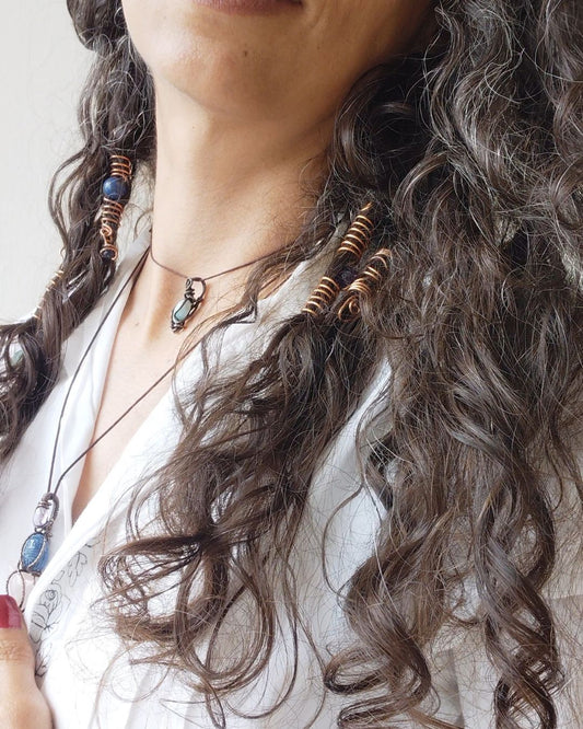Extend your self-expression. Sleek, minimalist copper loc coils designed to embrace natural texture. Earthy hair jewelry, handmade in Lebanon at Sacred.