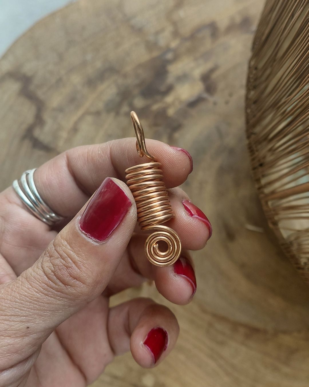 Extend your self-expression. Sleek, minimalist copper loc coils designed to embrace natural texture. Earthy hair jewelry, handmade in Lebanon at Sacred.