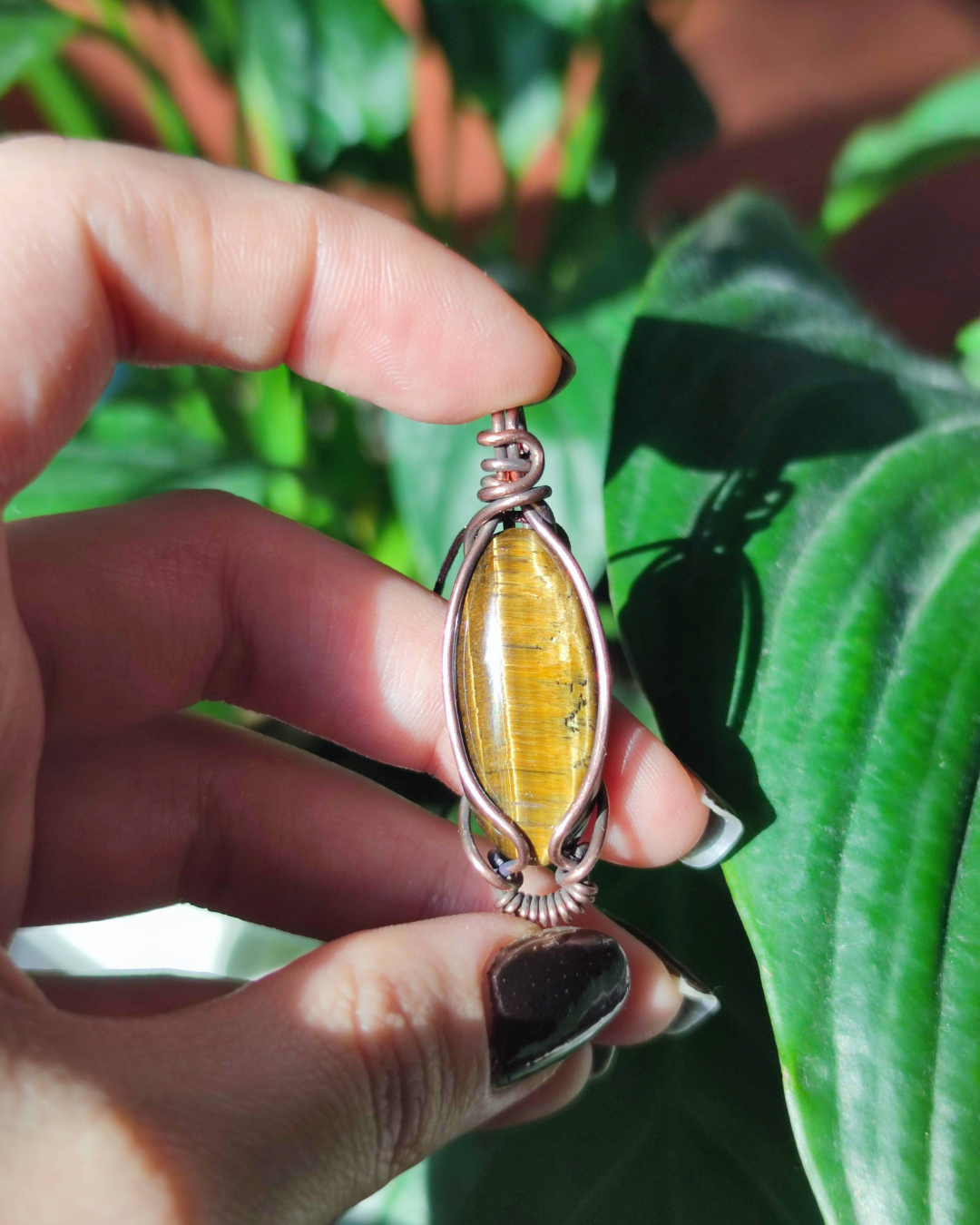 Ignite your inner warrior with Solar Blade. Invest in our marquise-cut Tiger's Eye Pendant from our Energy Clearing Jewelry Collection in Lebanon at Sacred.