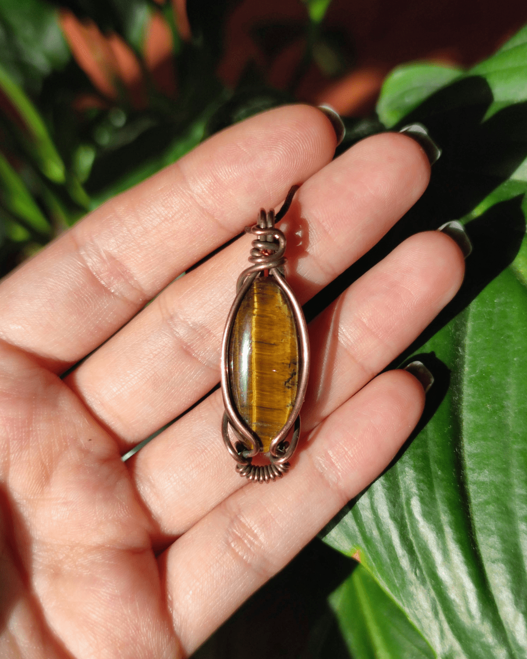 Ignite your inner warrior with Solar Blade. Invest in our marquise-cut Tiger's Eye Pendant from our Energy Clearing Jewelry Collection in Lebanon at Sacred.